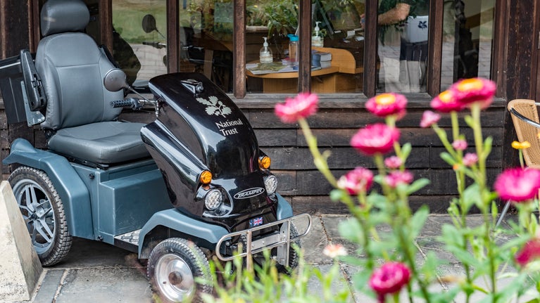 National Trust mobility vehicle parked outside the visitor reception at Stourhead, Wiltshire